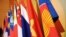 The Association of the Southeast Asian Nations (ASEAN) flag, right, leads the flags of the 10 member countries during the ASEAN Regional Forum meeting in Singapore.