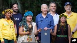 President Joe Biden poses for a photo after signing a proclamation designating Nov. 17 as International Conservation Day, following a tour of the Museu da Amazonia, in Manaus, Brazil, Nov. 17, 2024.