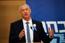FILE - Blue and white party leader Benny Gantz speak during his party's faction meeting in Jerusalem, Oct. 3, 2019.
