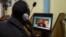 FILE - An Ethiopian streams a video of Prime Minister Abiy Ahmed speaking, at an internet cafe in Addis Ababa, Ethiopia, Nov. 26, 2020. Journalists say a government-imposed blackout in Ethiopia has made it difficult to document the fighting in Tigray. 