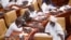FILE - Members of Parliament of Ghana interact during a break from electing a new leader of parliament in Accra, Ghana, on Jan. 7, 2021. 