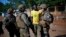 FILE - French Sangaris peacekeepers are seen speaking to a local resident outside Fatima Church in Bangui, Central African Republic.