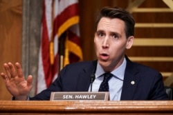 FILE - Sen. Josh Hawley, R-Mo., asks questions during a hearing in Washington, Dec. 16, 2020.