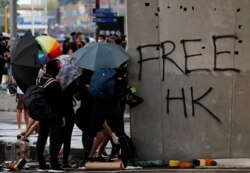 Anti-government demonstrators attend a protest march in Hong Kong, Oct. 20, 2019.