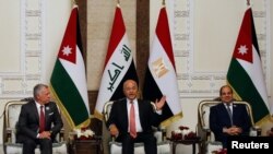Iraqi President Barham Salih meets with King Abdullah II of Jordan and Egypt's President Abdel Fattah el-Sissi, in Baghdad, Iraq, June 27, 2021. 