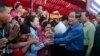 FILE PHOTO - Prime Minister Hun Sen greets garment workers during a visit to a factory outside of Phnom Penh, Cambodia, Wednesday, Aug. 30, 2017. 