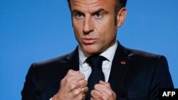 French President Emmanuel Macron speaks during a press conference on the second and last day of a European Union summit at the EU headquarters in Brussels on Oct. 27, 2023. Macron said he would help to build a "humanitarian coalition" for Palestinians in Gaza.