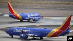 FILE - Southwest Airlines planes are seen at Phoenix Sky Harbor International Airport in Phoenix, Arizona, July 17, 2019. 