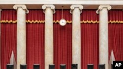 FILE - This Sept. 19, 2020, photo provided by the Supreme Court, shows the Bench draped in memory of liberal Justice Ruth Bader Ginsburg, at the Supreme Court in Washington. Republicans are rushing to fill the vacant seat with their conservative nominee.