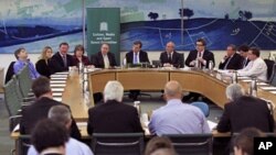 British members of Parliament face the media during the Department of Culture Media and Sport press conference announcing a cross-party report on phone hacking in London, May 1, 2012. 
