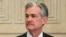 FILE - Federal Reserve Gov. Jerome Powell talks with others before a Board of Governors meeting in Washington, Nov. 30, 2015.