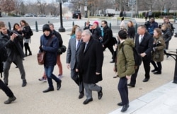 Lev Parnas, the indicted associate of U.S. President Donald Trump's personal lawyer, Rudy Giuliani, talks to his attorney, Joseph Bondy, as he walks to the U.S. Capitol after arriving in Washington, Jan. 29, 2020.