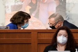 Sen. Dianne Feinstein, D-Calif., speaks Sen. Richard Durbin, D-Ill., during the confirmation hearing for Supreme Court nominee Amy Coney Barrett at the Senate Judiciary Committee on Capitol Hill in Washington, Monday, Oct. 12, 2020.