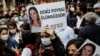 Demonstrators carry pictures of Deniz Poyraz, who was killed in an attack on a local office of the pro-Kurdish Peoples' Democratic Party (HDP), during a protest in Istanbul, Turkey, June 18, 2021. Banner reads "Deniz Poyraz is immortal."