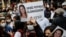 Demonstrators carry pictures of Deniz Poyraz, who was killed in an attack on a local office of the pro-Kurdish Peoples' Democratic Party (HDP), during a protest in Istanbul, Turkey, June 18, 2021. Banner reads "Deniz Poyraz is immortal."