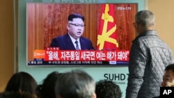 South Koreans watch North Korean leader Kim Jong Un's New Year's speech on TV at the Seoul Railway Station in Seoul, South Korea, Jan. 1, 2017. Kim said North Korea's development of long-range missiles is in "final stages." 