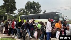 Humanitarian staff who fled from Goma, eastern Democratic Republic of Congo, following fighting between M23 rebels and the armed forces of the Democratic Republic of the Congo, arrive in Gisenyi, Rwanda, Jan. 27, 2025.