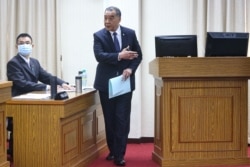 FILE - Defense Minister Chiu Kuo-cheng takes a break from speaking to lawmakers at the parliament in Taipei, Taiwan, March 25, 2021.