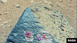This image shows where NASA's Curiosity rover aimed two different instruments to study a rock known as "Jake Matijevic." (NASA/JPL-Caltech/MSSS)