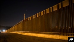 A portion of the new steel border fence stretches along the US-Mexico border in Sunland Park, New Mexico, March 30, 2017. This fencing just west of the New Mexico state line was planned and started before President Donald Trump's election.