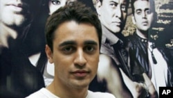 Bollywood actor Imran Khan poses for a picture during a promotional event for his forthcoming movie 'Luck' at a radio station in Mumbai, July 20, 2009