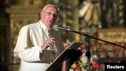Pope Francis speaks with members of the civil society at the San Francisco Church in Quito, Ecuador, July 7, 2015. 