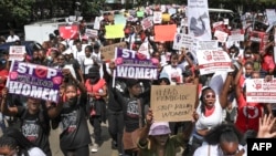 Activists march at a demonstration against an alarming rise in murders of young women in Kenya, in Nairobi on Jan. 27, 2024.