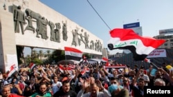 Iraqi demonstrators take part in anti-government protests at Tahrir Square in Baghdad, Iraq, Nov. 2, 2019.