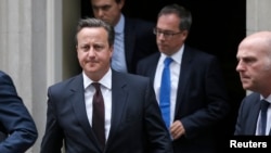 British Prime Minister, David Cameron leaves 10 Downing Street in London, Britain, Sept. 7, 2015. Cameron will address Parliament on Britain's response to the migrant crisis in Europe. 