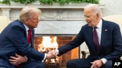 President Joe Biden meets with President-elect Donald Trump in the Oval Office of the White House, in Washington, Nov. 13, 2024.