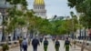 Police officers walk along El Paseo del Prado street in Havana, on November 15, 2021.