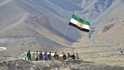 TOPSHOT - Afghan resistance movement and anti-Taliban uprising forces stand guard on a hilltop in the Astana area of Bazarak in Panjshir province on August 27, 2021, as among the pockets of resistance against the Taliban following their takeover of…