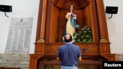 A Catholic parishioner prays at the Metropolitan Cathedral amid a suspension of diplomatic ties between Nicaragua and the Vatican, in Managua, Nicaragua, March 12, 2023.