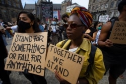 People take part in a Black Lives Matter protest in Amsterdam, Netherlands, June 1, 2020.