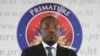 Interim Prime Minister Claude Joseph stand before delivering his speach during the appointment of Ariel Henry as the new Prime Minister in Port-au-Prince, Haiti, July 20, 2021