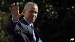 FILE - President Barack Obama waves as he walks toward Marine One on the South Lawn of the White House in Washington, before a short trip to Andrews Air Force Base, Md.