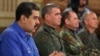 FILE - Venezuela's President Nicolas Maduro speaks during a broadcast with members of the government and military high command members at Miraflores Palace in Caracas, April 30, 2019. (Miraflores Palace handout via Reuters) 