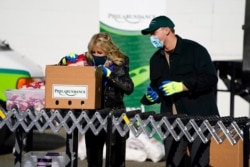President-elect Joe Biden's wife, Jill Biden, participates in a National Day of Service event at Philabundance, a hunger relief organization, in Philadelphia, Jan. 18, 2021.