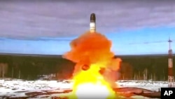 FILE - In this handout photo released by the Roscosmos Space Agency Press Service on April 20, 2022, the Sarmat intercontinental ballistic missile is launched from Plesetsk in northwestern Russia. 