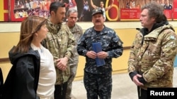 Argentine President Javier Milei, accompanied by Defense Minister Luis Petri visits an area affected by a severe electrical storm, in Bahia Blanca, Argentina, Dec. 17, 2023 in this handout image. (Argentine Defense Ministry/Handout via REUTERS)