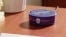 The Alexa Echo Dot devices include the official Saint Louis University logo and are equipped with specific skills to provide information on local events and campus life. (Screengrab for Saint Louis University Video)