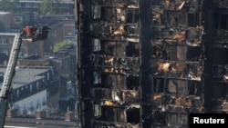 Damage is seen to a tower block which was destroyed in a fire disaster, in north Kensington, West London, Britain June 15, 2017. 