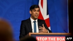 Britain's Prime Minister Rishi Sunak reacts as he gives a press conference, following the Supreme Court’s Rwanda policy judgement, at Downing Street, in central London, Nov. 15, 2023.
