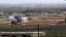 FILE - An image made from militant video posted online by the Aamaq News Agency, a media arm of the Islamic State group, Jan. 9, 2017, purports to show the moment of a Turkish missile strike, in the northern Syrian town of al-Bab, in Aleppo province, Syria. 