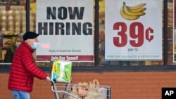 FILE - A man walks out of a Marc's Store in Mayfield Heights, Ohio, Jan. 8, 2021. The Bureau of Labor Statistics reported May 7, 2021, that the U.S. economy added only 266,000 jobs in April.