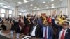Somali legislators of the lower house of parliament raise their hands to vote to extend President Mohamed Abdullahi Mohamed's term for another two years, in Mogadishu, April 12, 2021.