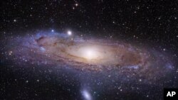 This undated image provided by the University of Utah shows the Andromeda galaxy, made by the Hubble Space Telescope. 
