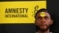 FILE - Human rights campaigner looks on during the release of an Amnesty International report in Abuja, Nigeria, May 16, 2017. 