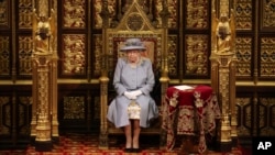 Britain's Queen Elizabeth II delivers a speech in the House of Lords during the State Opening of Parliament at the Palace of Westminster in London, May 11, 2021. (Chris Jackson/Pool via AP)