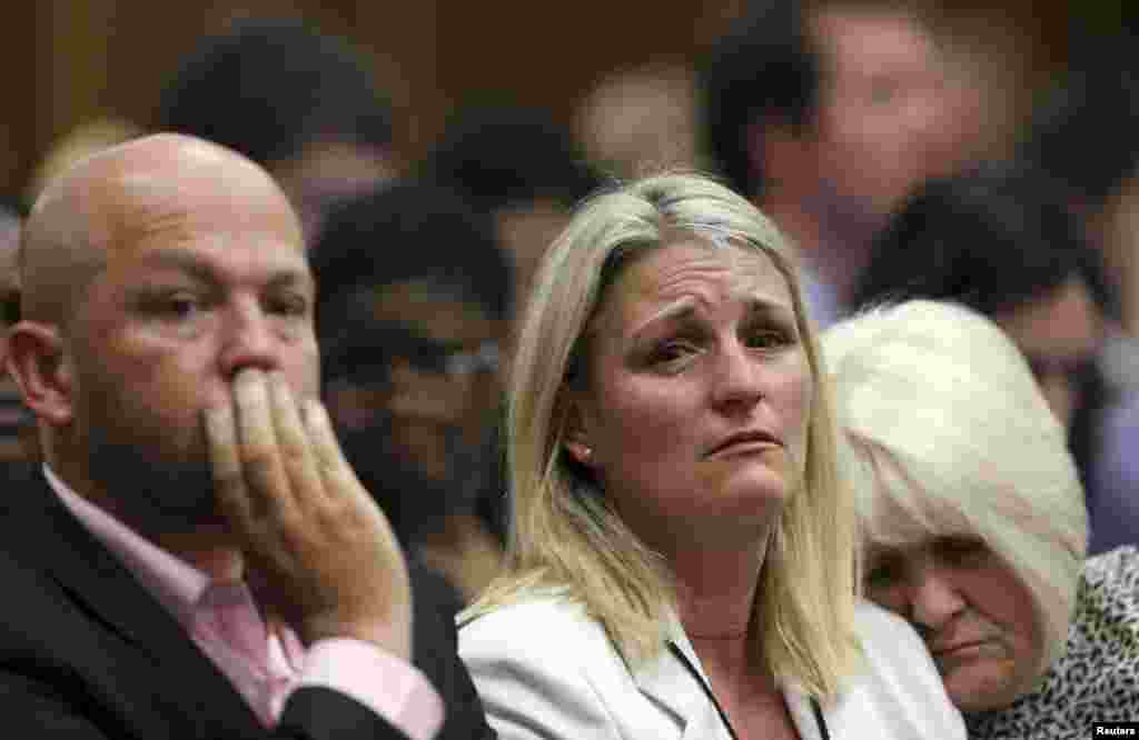 The family members of Reeva Steenkamp react as the verdict is handed down, Sept. 12, 2014.